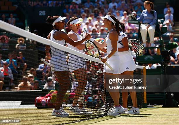 Martina Hingis of Switzerland and Sania Mirza of India celebrate winning the Ladies' Doubles Semi Final match against Raquel Kops-Jones of the United...