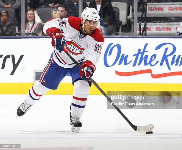 Francis Bouillon of the Montreal Canadiens makes a pass against the Toronto Maple Leafs during an NHL game at the Air Canada Centre on March 22, 2014...