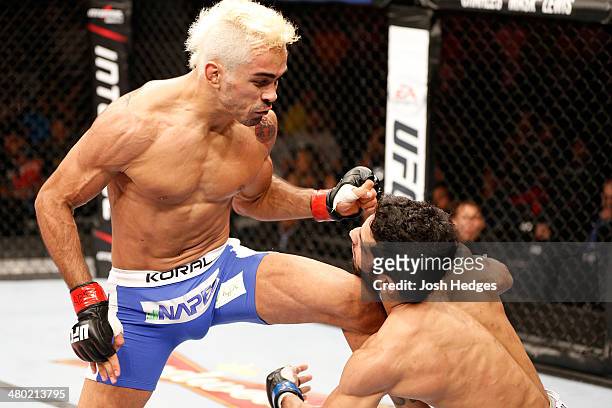 Godofredo "Pepey" Castro knocks out Noad Lahat with a flying knee in their featherweight bout during the UFC Fight Night event at Ginasio Nelio Dias...