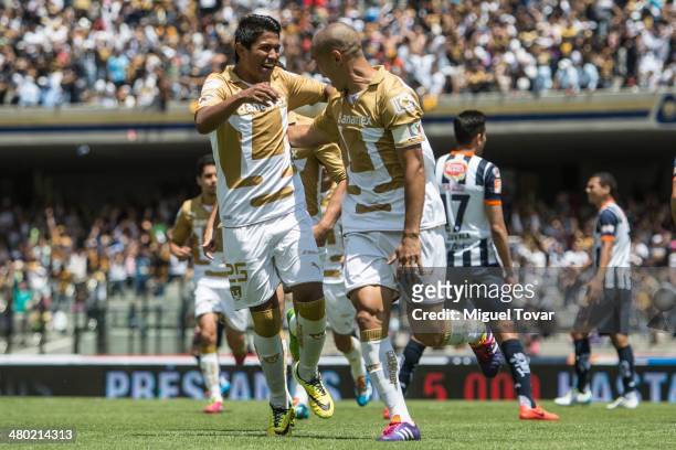Dario Veron of Pumas celebrates with his teammates after scoring the second goal against Monterrey during a match between Pumas UNAM and Monterrey as...
