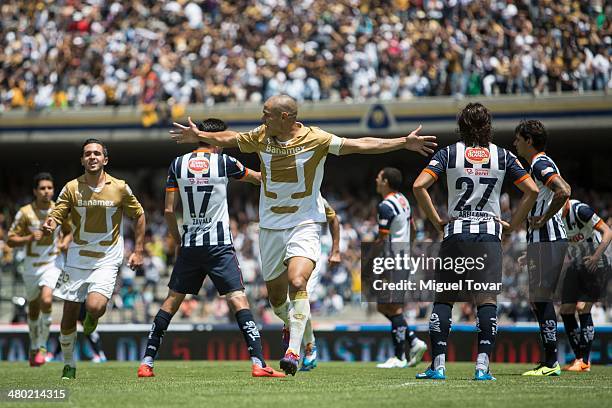 Dario Veron of Pumas celebrates with his teammates after scoring the second goal against Monterrey during a match between Pumas UNAM and Monterrey as...