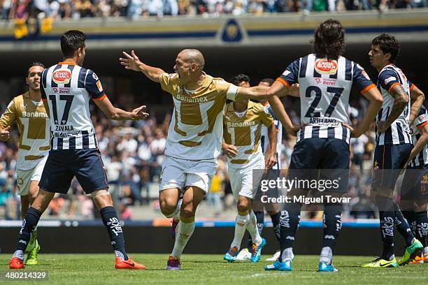 Dario Veron of Pumas celebrates with his teammates after scoring the second goal against Monterrey during a match between Pumas UNAM and Monterrey as...