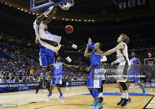 Wichita State Shockers forward Cleanthony Early goes for a big dunk against the Kentucky Wildcats center Dakari Johnson during the third round of the...