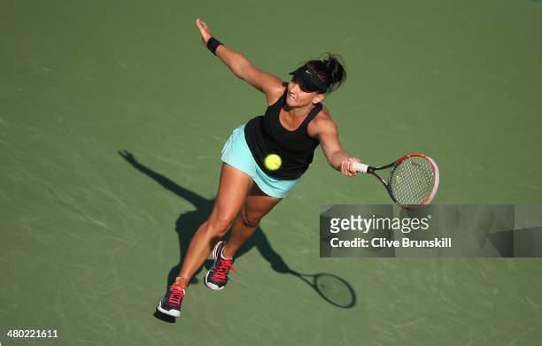 Casey Dellacqua of Australia stretches to play a forehand against Venus Williams of the United States during their third round match during day 7 at...