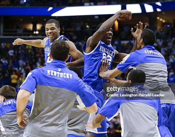Kentucky Wildcats guard Aaron Harrison and Alex Poythress celebrate at the end of the game against the Wichita State Shockers during the third round...