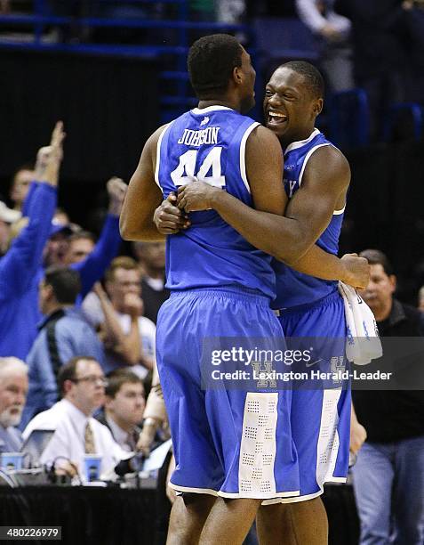 Kentucky Wildcats center Dakari Johnson and Julius Randle celebrates during the third round of the NCAA Tournament in St. Louis on Sunday, March 23,...