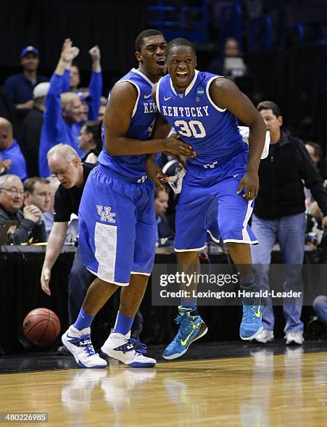 Kentucky Wildcats center Dakari Johnson and Julius Randle celebrate at the end of the game against the Wichita State Shockers during the third round...