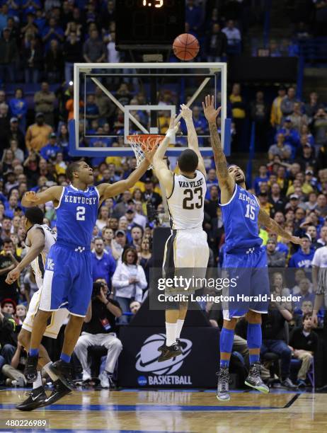 The potential game-winning shot by Wichita State Shockers guard Fred VanVleet was off the mark as he was defended by Kentucky Wildcats guard Aaron...