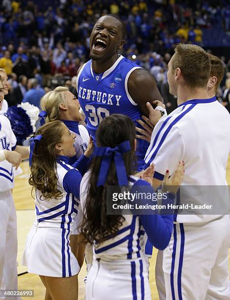 Kentucky Wildcats forward Julius Randle celebrates with the cheerleaders after scoring 13 points and grabbing 10 rebounds against the Wichita State...