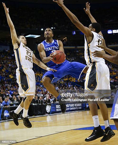 Kentucky Wildcats guard Aaron Harrison drives the lane for a basket against the Wichita State Shockers during the third round of the NCAA Tournament...