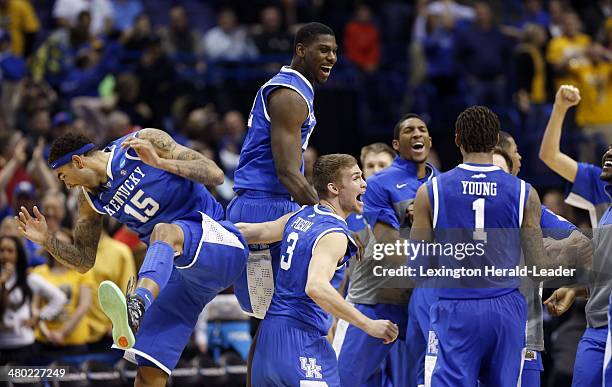 The University of Kentucky team celebrate at the end of their game against the Wichita State Shockers during the third round of the NCAA Tournament...