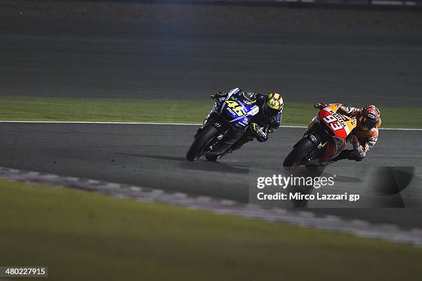 Marc Marquez of Spain and Repsol Honda Team leads Valentino Rossi of Italy and Movistar Yamaha MotoGP during the MotoGP race during the MotoGp of...