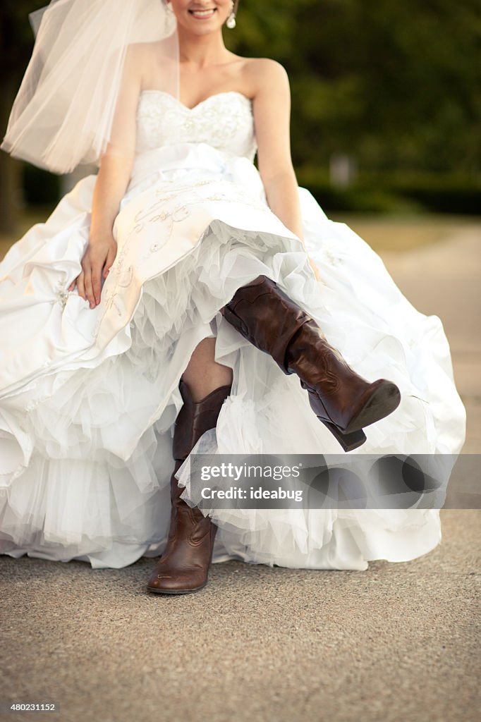 Happy Bride in Wedding Dress and Cowboy Boots