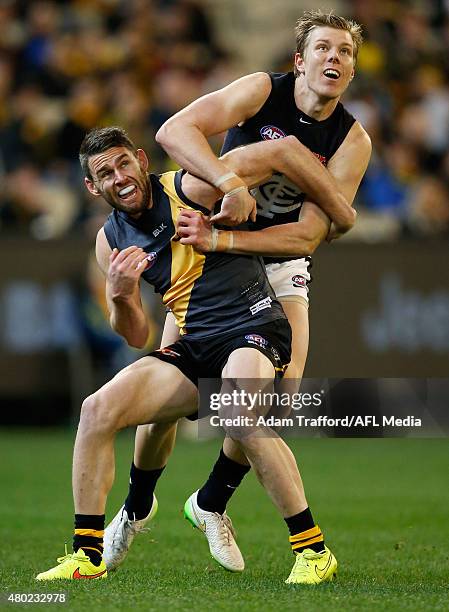 Chris Newman of the Tigers and Tom Fields of the Blues compete for the ball during the 2015 AFL round 15 match between the Richmond Tigers and the...