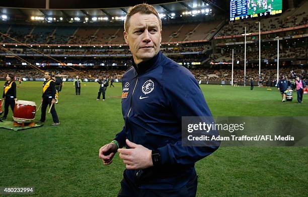 John Barker, Interim Coach of the Blues looks on during the 2015 AFL round 15 match between the Richmond Tigers and the Carlton Blues at the...