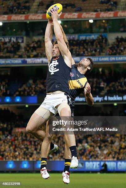 Levi Casboult of the Blues marks the ball over Alex Rance of the Tigers during the 2015 AFL round 15 match between the Richmond Tigers and the...