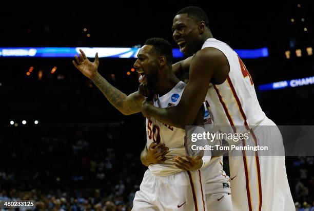 DeAndre Kane and Daniel Edozie of the Iowa State Cyclones celebrate after defeating the North Carolina Tar Heels 85-83 in the third round of the 2014...