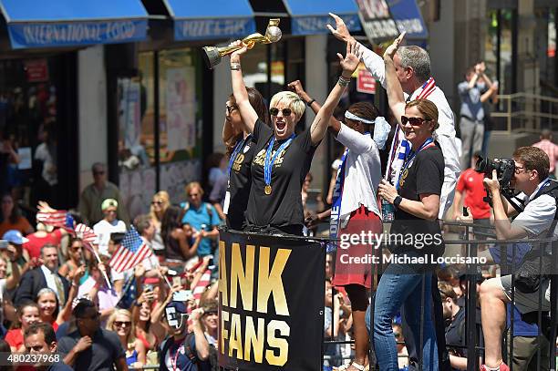 Soccer players Carli Lloyd and Megan Rapinoe, Chirlane McCray, Mayor Bill de Blasio and U.S. Coach Jill Ellis aboard a float in the New York City...