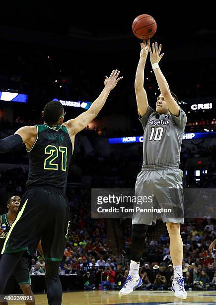 Grant Gibbs of the Creighton Bluejays takes a shot as Isaiah Austin of the Baylor Bears defends during the third round of the 2014 NCAA Men's...