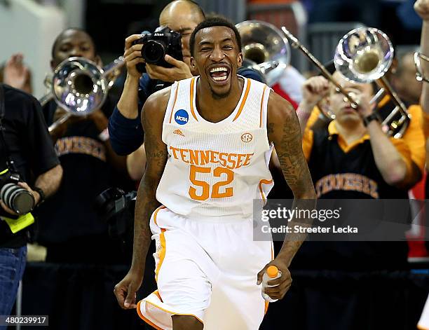 Jordan McRae of the Tennessee Volunteers celebrates late in the game against the Mercer Bears during the third round of the 2014 NCAA Men's...
