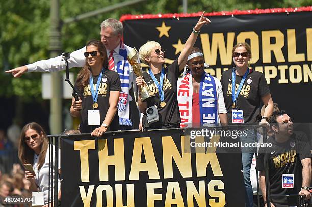 Soccer player Carli Lloyd, Mayor Bill de Blasio, soccer player Megan Rapinoe, Chirlane McCray and U.S. Coach Jill Ellis aboard a float in the New...