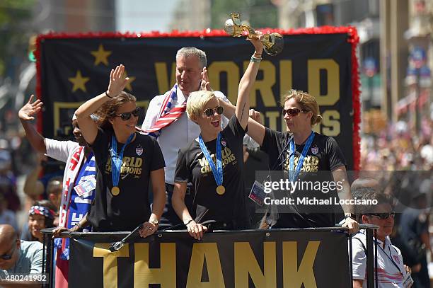 Chirlane McCray, soccer player Carli Lloyd Mayor Bill de Blasio, soccer player Megan Rapinoe and U.S. Coach Jill Ellis aboard a float in the New York...