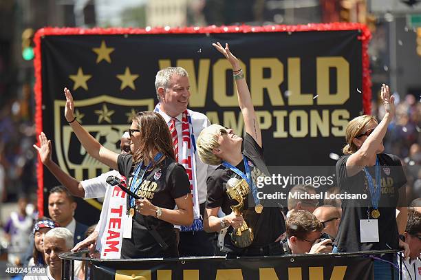 Chirlane McCray, soccer player Carli Lloyd Mayor Bill de Blasio, soccer player Megan Rapinoe and U.S. Coach Jill Ellis aboard a float in the New York...