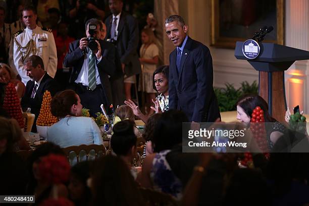President Barack Obama drops by as the first lady Michelle Obama hosts the annual Kids State Dinner at the East Room of the White House July 10, 2015...