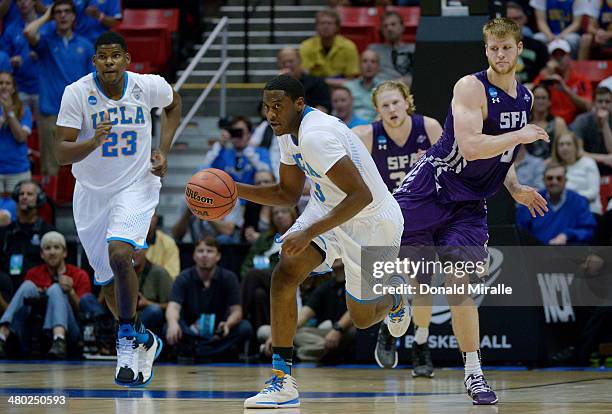 Jordan Adams of the UCLA Bruins drives against the Stephen F. Austin Lumberjacks during the third round of the 2014 NCAA Men's Basketball Tournament...