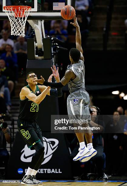 Austin Chatman of the Creighton Bluejays goes up for a shot as Isaiah Austin of the Baylor Bears defends during the third round of the 2014 NCAA...