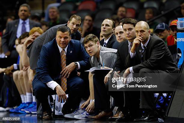 Head coach Greg McDermott speaks with Grant Gibbs of the Creighton Bluejays in the closing minutes of their game against the Baylor Bears in the...