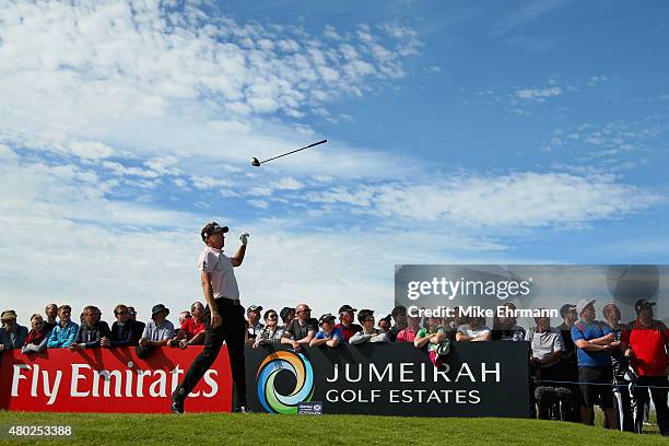 Ian Poulter of England tosses his club in the air after hitting his tee shot on the 16th hole during the second round of the Aberdeen Asset...