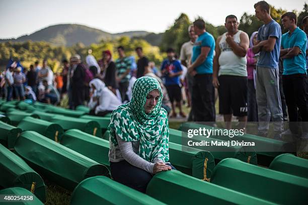 Woman mourns over a coffin among 136 coffins of victims of the 1995 Srebrenica massacre at the Potocari cemetery and memorial near Srebrenica on July...