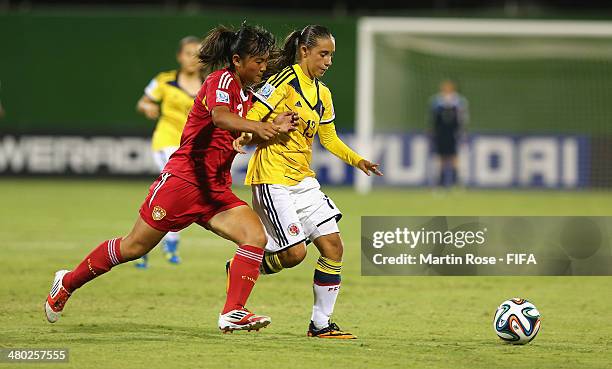 Valentina Carvajal of Colombia and Ruyi Wan of China battle for the ball during the FIFA U-17 Women's World Cup 2014 group D match between Paraguay...