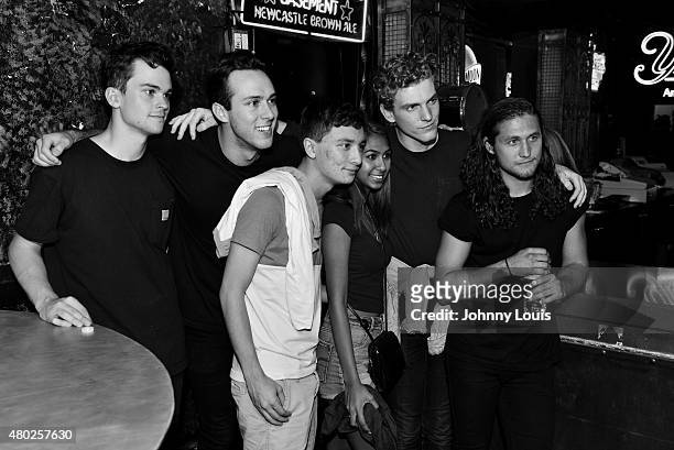 Zach Dyke, Ryan Winnen, Chase Lawrence and Joe Memmel of COIN pose for picture with fans during An Intimate Night Out at Revolution Live on July 9,...