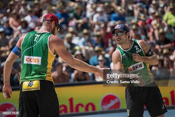 Alison Conte Cerutti, Bruno Oscar Schmidt of Brasil celebrate during the Swatch Beach Volleyball Major Series on July 10, 2015 in Gstaad, Switzerland.