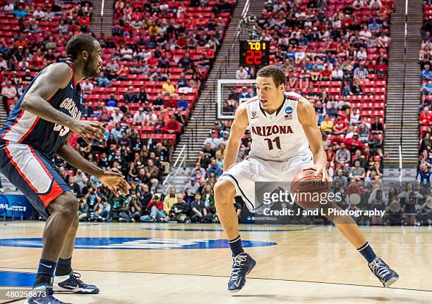 Aaron Gordon of the Arizona Wildcats handles the ball against Sam Dower of the Gonzaga Bulldogs in the third round of the 2014 NCAA Men's Basketball...