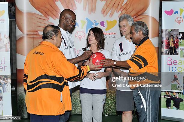 Datuk Muhammad Feisol Hassan President of the Special Olympics Malaysia with Laureus Academy Member Nadia Comaneci, Laureus Academy Chairman Edwin...