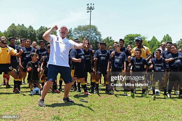 Laureus Academy Member Sean Fitzpatrick leads a 'haka' alongside players during the LWSA COBRA Rugby Project Visit ahead of the Laureus World Sports...