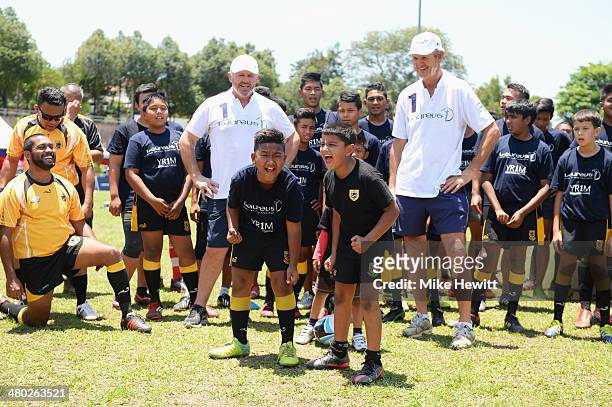 Laureus Academy Member Sean Fitzpatrick and Morne du Plessis teach players a 'haka' during the LWSA COBRA Rugby Project Visit ahead of the Laureus...