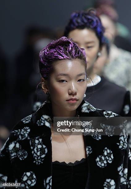 Model showcases designs on the runway during the Steve J and Yoni P show as part of Seoul Fashion Week F/W 2014 on March 24 in Seoul, South Korea.