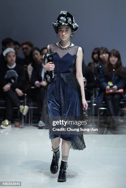 Model showcases designs on the runway during the Steve J and Yoni P show as part of Seoul Fashion Week F/W 2014 on March 24 in Seoul, South Korea.
