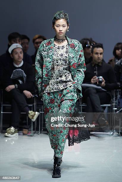 Model showcases designs on the runway during the Steve J and Yoni P show as part of Seoul Fashion Week F/W 2014 on March 24 in Seoul, South Korea.