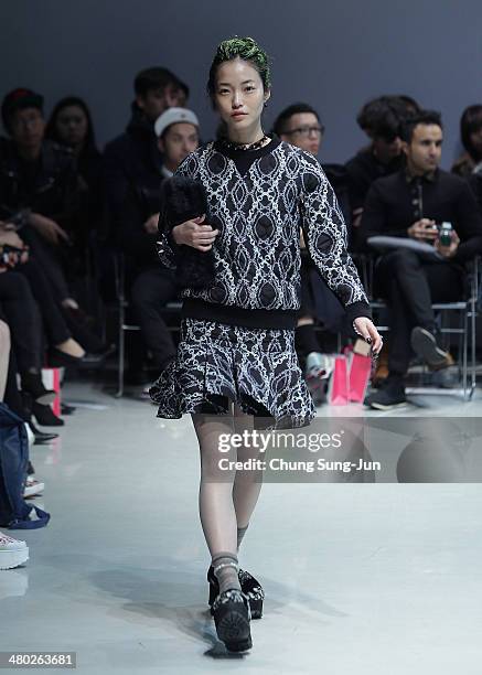 Model showcases designs on the runway during the Steve J and Yoni P show as part of Seoul Fashion Week F/W 2014 on March 24 in Seoul, South Korea.