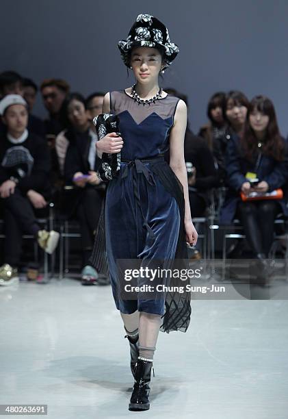 Model showcases designs on the runway during the Steve J and Yoni P show as part of Seoul Fashion Week F/W 2014 on March 24 in Seoul, South Korea.