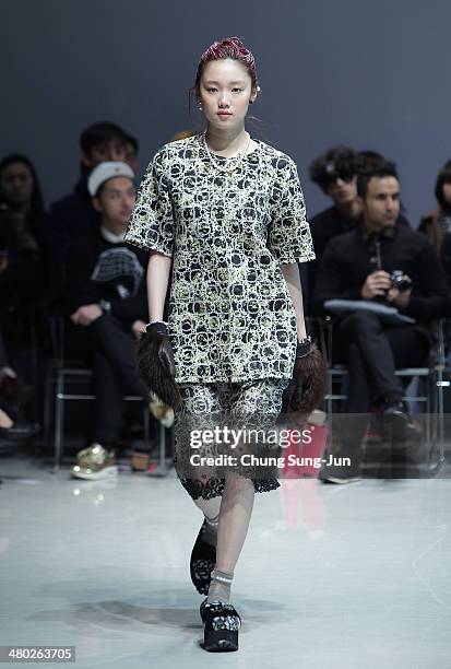 Model showcases designs on the runway during the Steve J and Yoni P show as part of Seoul Fashion Week F/W 2014 on March 24 in Seoul, South Korea.