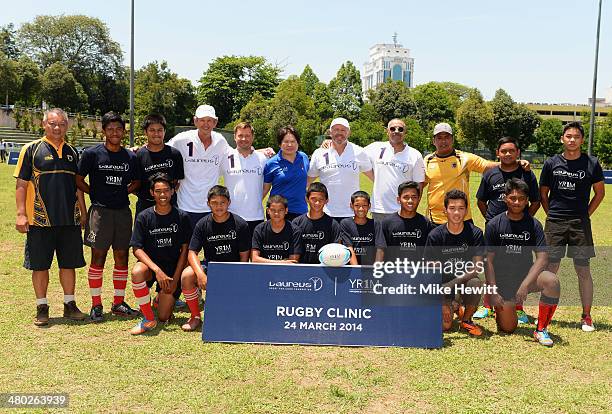 Laureus Academy Members Sean Fitzpatrick, Alexey Nemov, Daley Thompson and Morne du Plessis and CEO of YR1M Ung Su Ling pose with players and coaches...