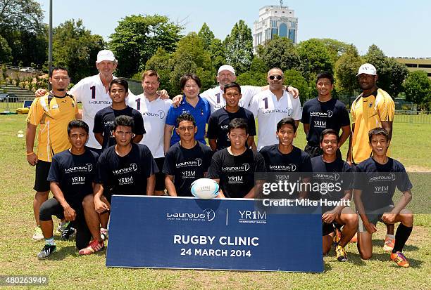 Laureus Academy Members Sean Fitzpatrick, Alexey Nemov, Daley Thompson and Morne du Plessis and CEO of YR1M Ung Su Ling pose with players and coaches...