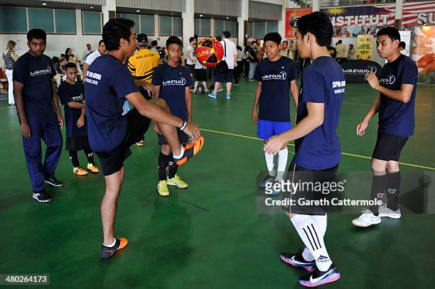 Players in action during the LWSA Special Olympics Project Visit part of the 2014 Laureus World Sports Awards on March 24, 2014 in Kuala Lumpur,...