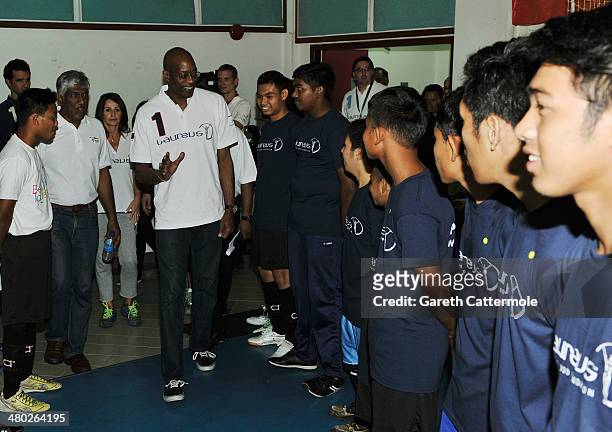 Laureus Academy Chairman Edwin Moses greets the players during the LWSA Special Olympics Project Visit part of the 2014 Laureus World Sports Awards...